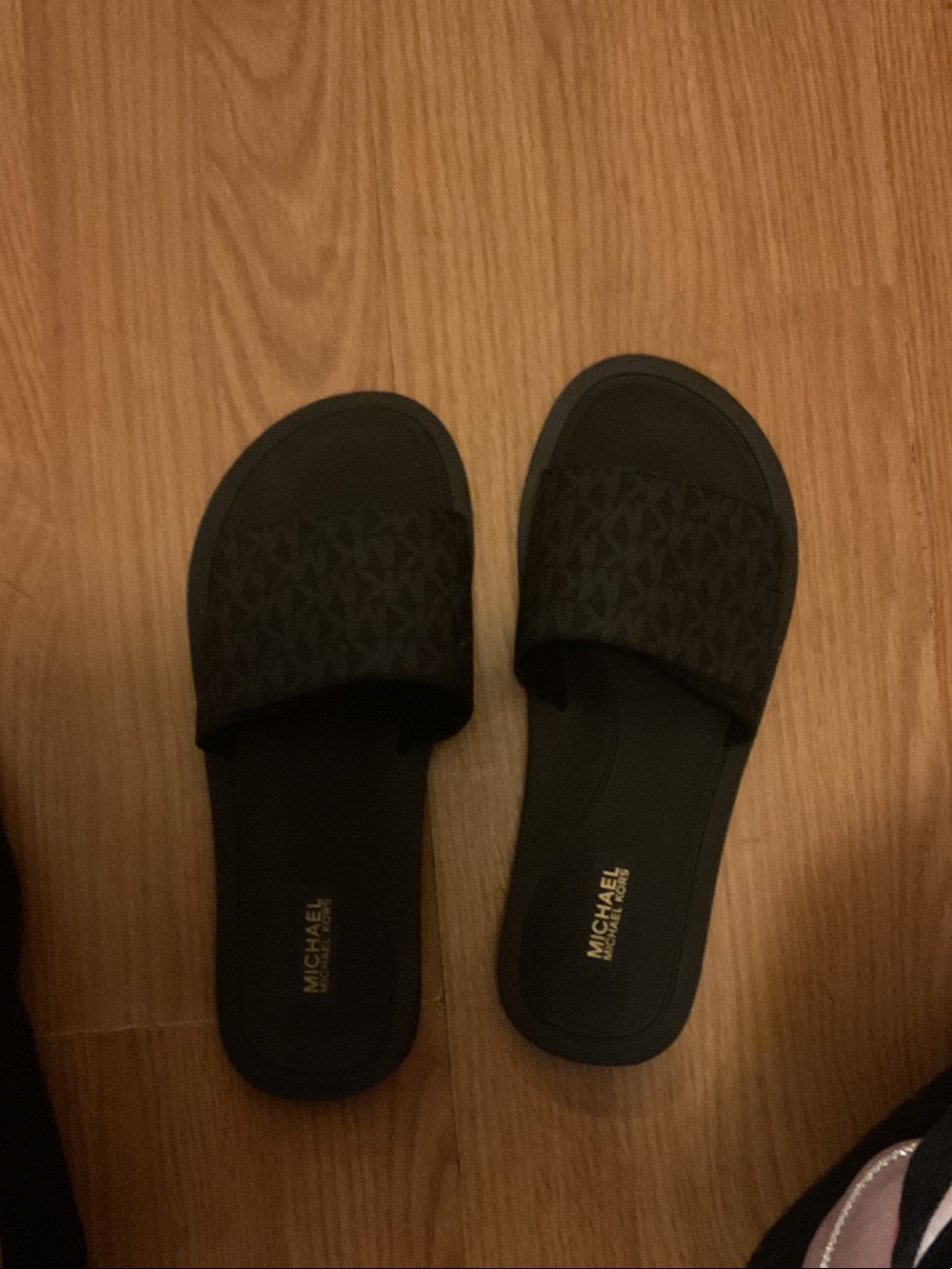MICHAEL Michael Kors Black Logo Slide Sandals with Gold Footbed Accent